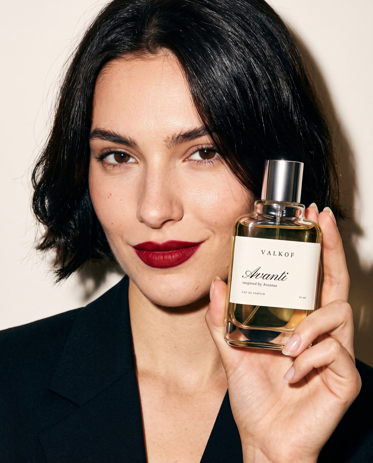 Woman holding VALKOF Avanti eau de parfum